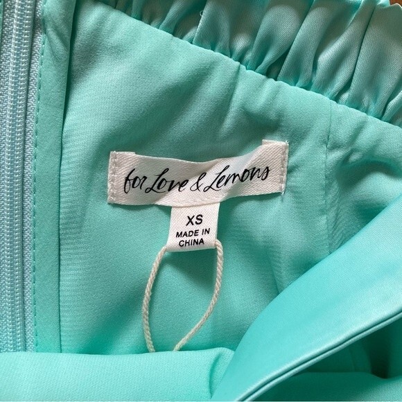 NEW For Love & Lemons Marie Asymmetrical Satin Aqua Side Slit Mini Skirt Size XS - Picture 12 of 15